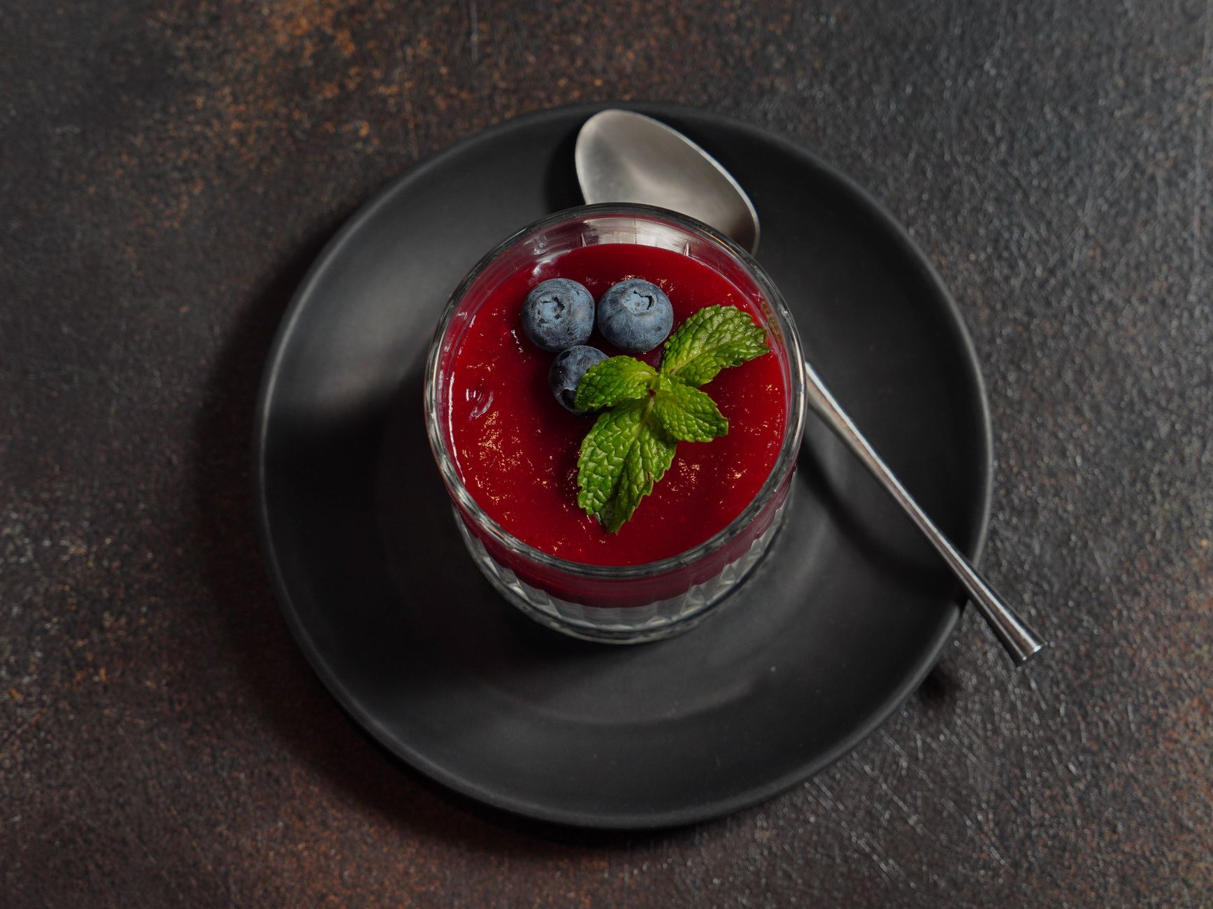 Lemon pudding brulee with blueberries in ramekins