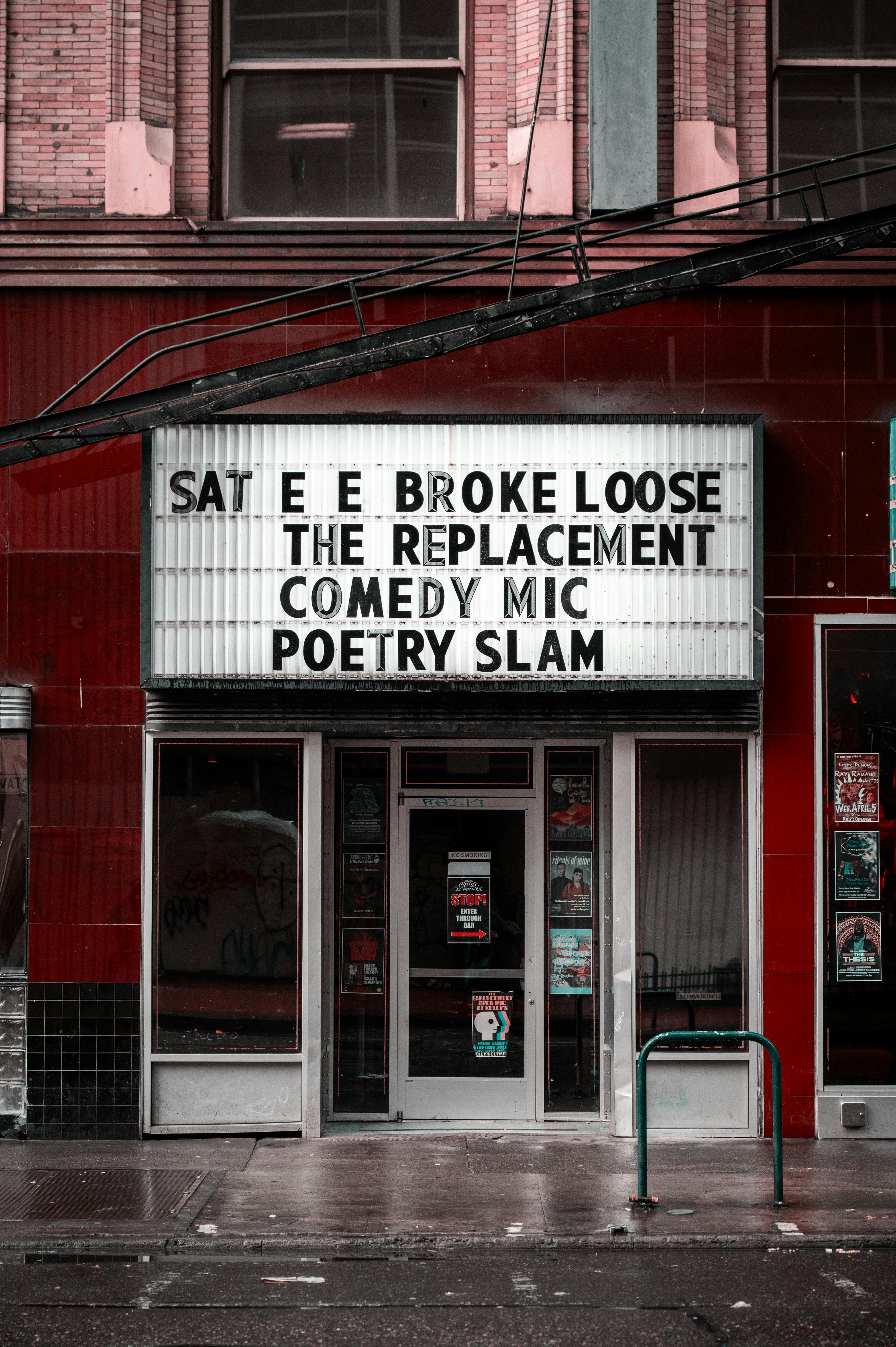Free Vertical shot of a vintage theater entrance in Portland, Oregon with a marquee featuring events. Stock Photo
