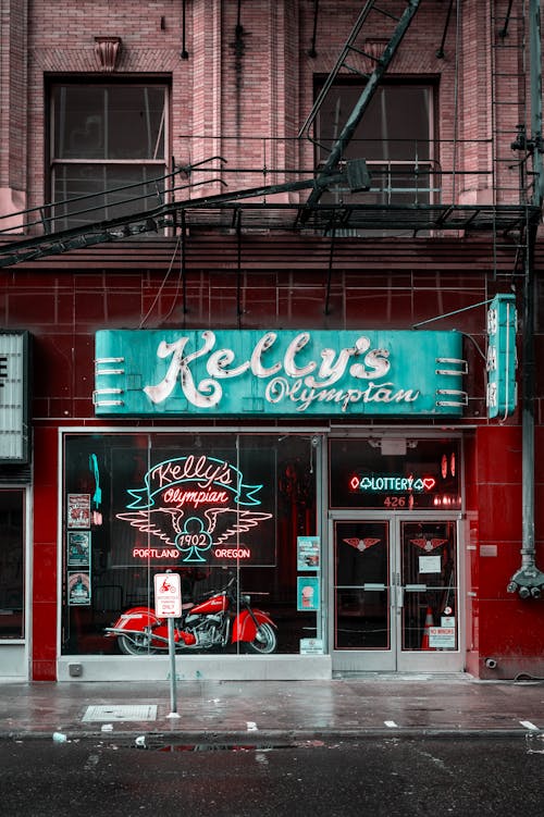 A red and black photo of a neon sign for a restaurant