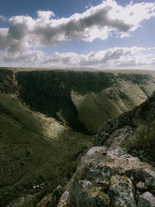 Free A wide-angle view of a scenic canyon landscape in B.C., México with clouds and cliffs. Stock Photo