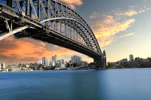 Foto stok gratis australia, jembatan pelabuhan sydney, matahari terbenam keemasan