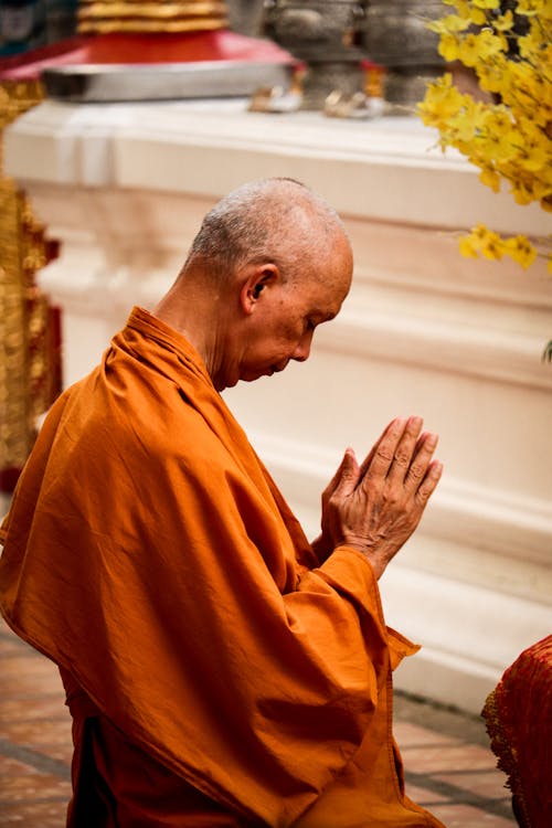 A monk praying in a temple
