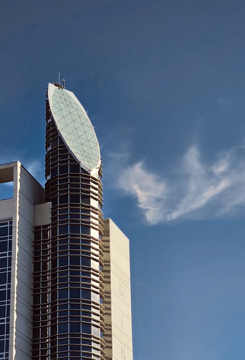 Foto profissional grátis de arquitetura contemporânea, arranha-céu, céu azul