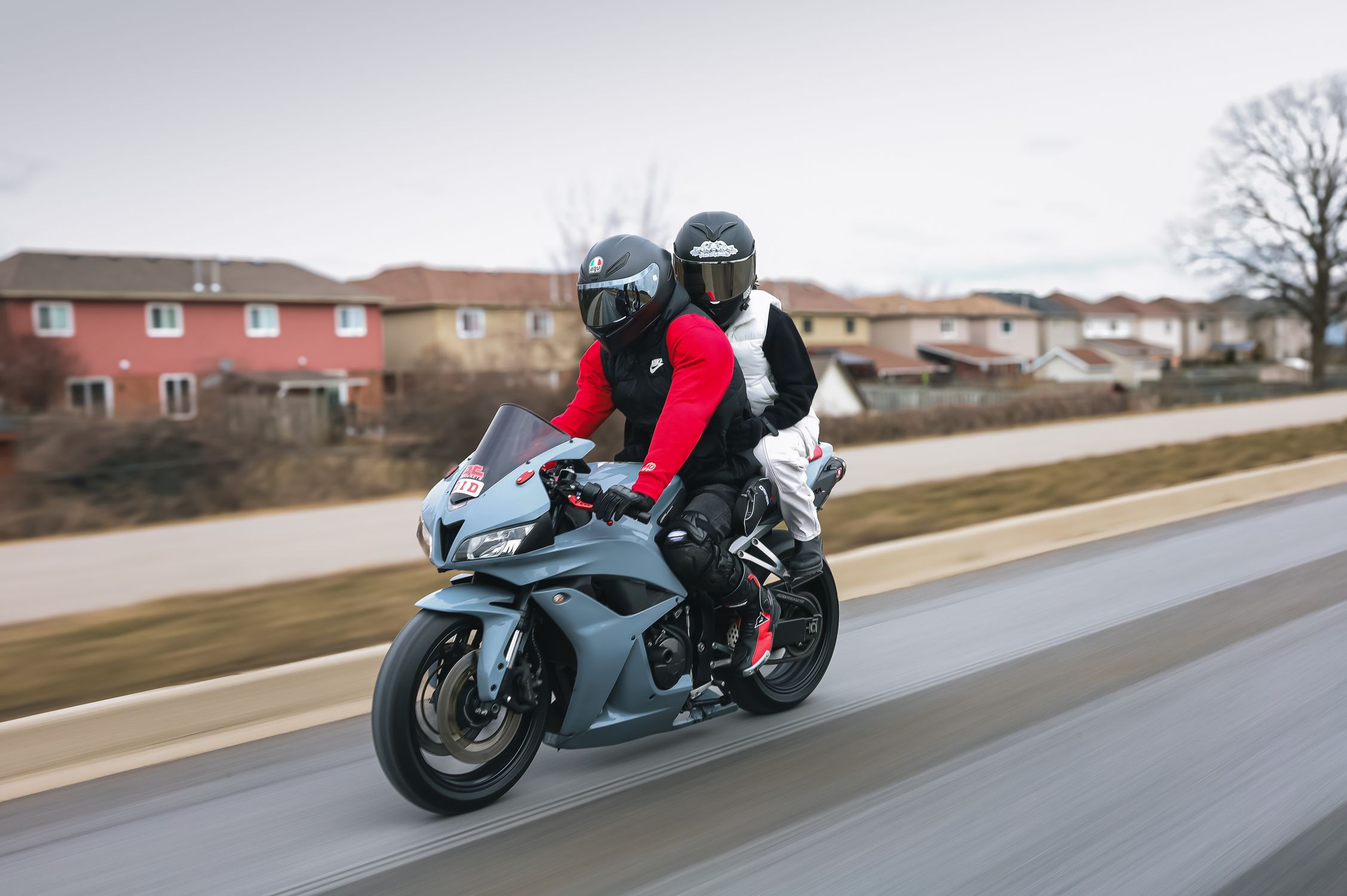 2 People Ride Motorcycle Two People Riding a Motorcycle · Free Stock Photo