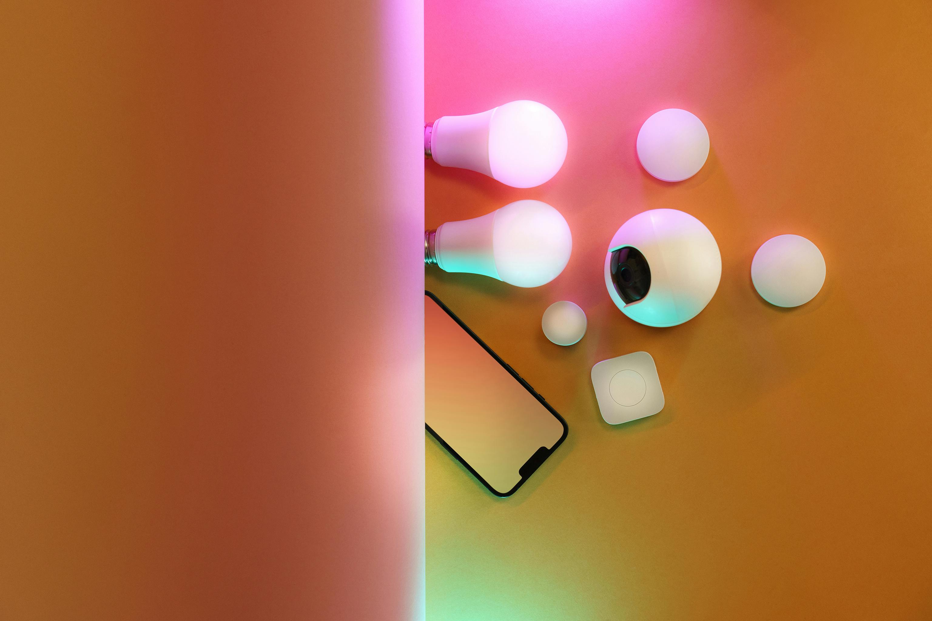 A flat lay of smart bulbs and devices, creating a vibrant tech ambiance.