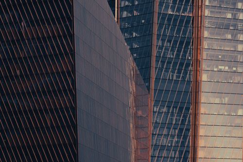 Free Captured at sunset, these modern skyscrapers with reflective glass in Saint Petersburg, Russia showcase architectural elegance. Stock Photo