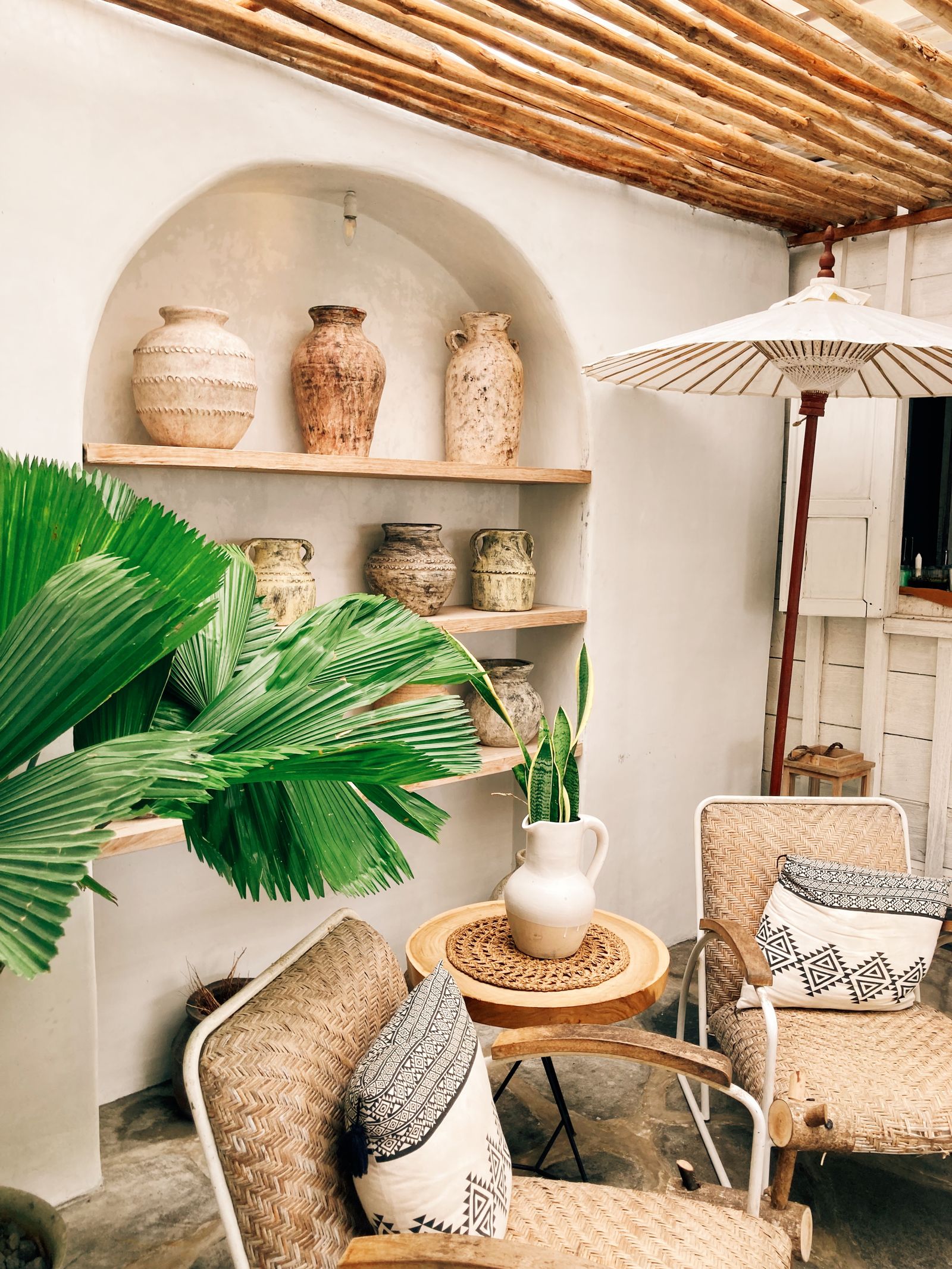bohemian home decor 2026 rattan furniture terracotta plants natural light interior