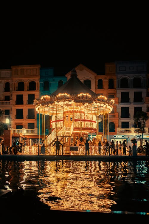 A carousel is lit up at night