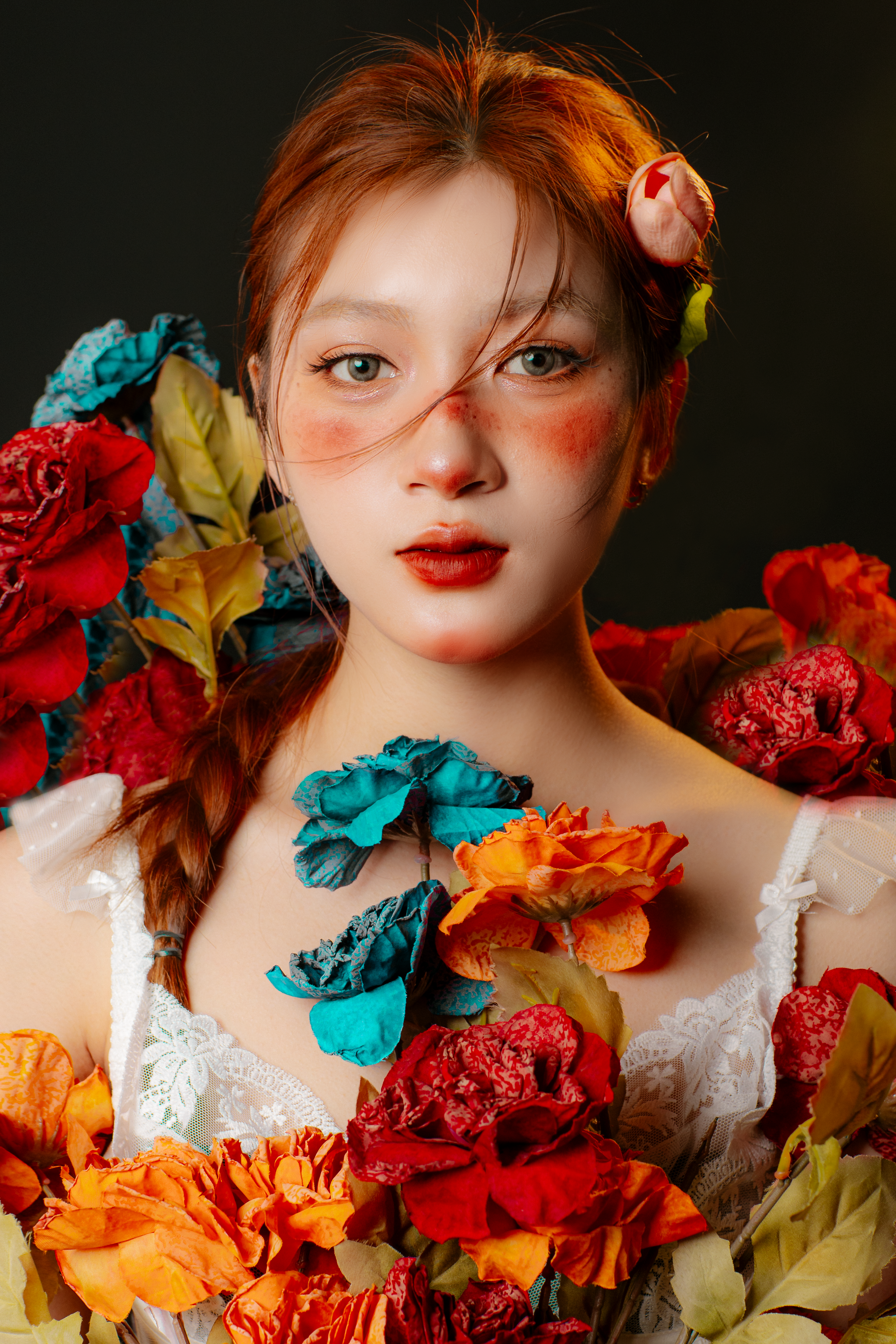A striking portrait of a woman adorned with colorful flowers and unique makeup, captured with vivid detail.
