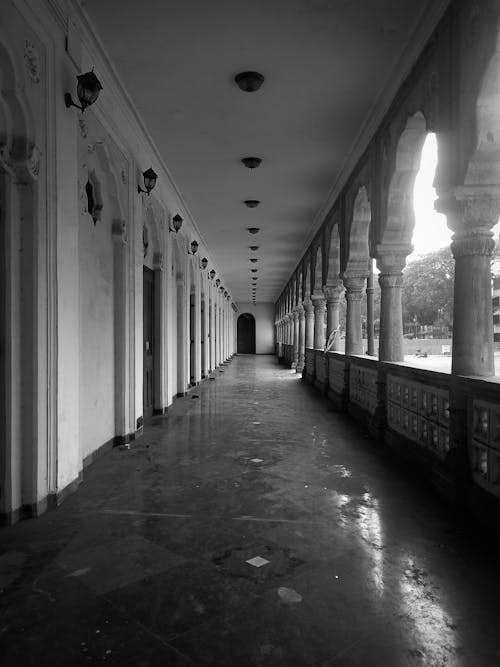 A long corridor with pillars and arches