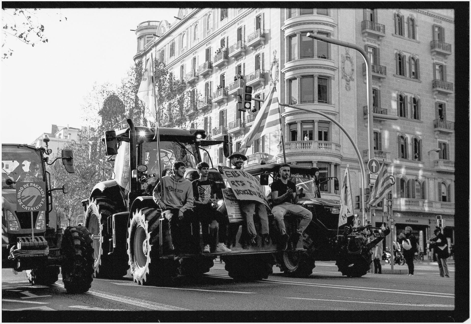 Men Protesting on Tractors on Street