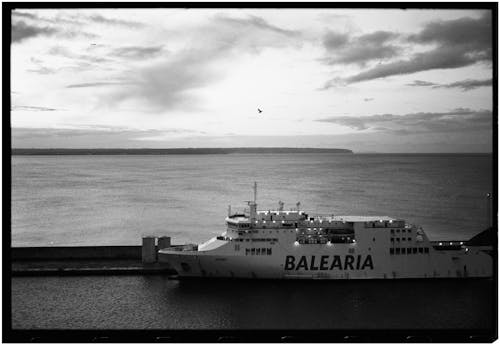 A black and white photo of a ferry boat