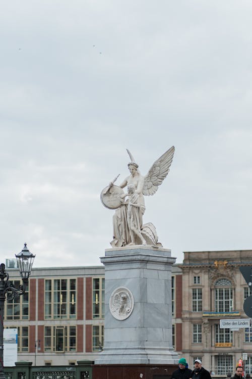A statue of an angel on top of a building