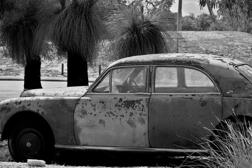 Free A black and white photo of a rusty, abandoned car in Whiteman, WA, Australia. Stock Photo
