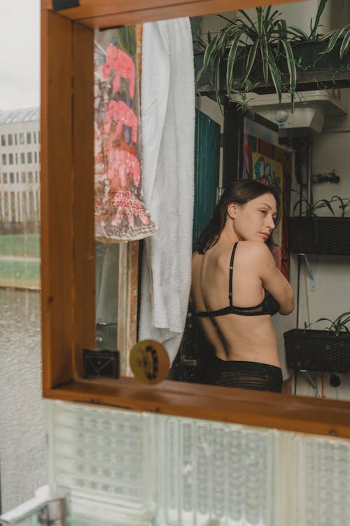 Mirror Reflection of Woman in Bra