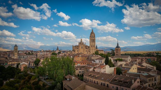 Scenic view of Segovia, Spain with the majestic Segovia Cathedral surrounded by old town buildings.