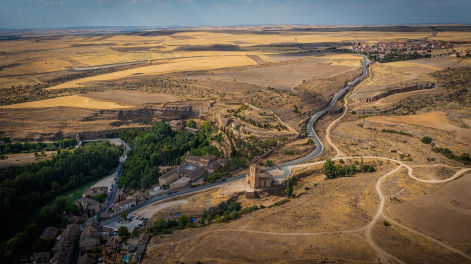 ALSA bus traveling through a scenic Spanish landscape, connecting regions.