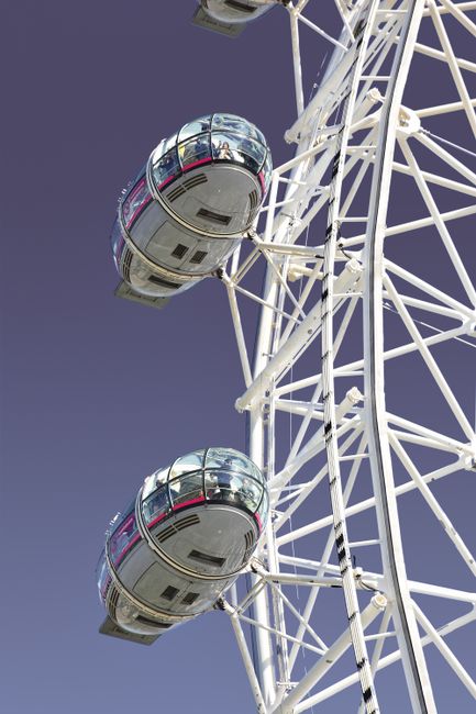 Detailed shot of modern Ferris wheel capsules against a clear sky