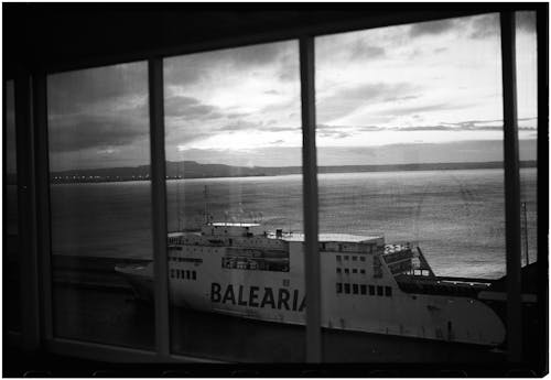 A black and white photo of a ferry boat