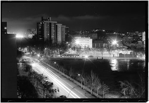Black and white photograph of a city at night