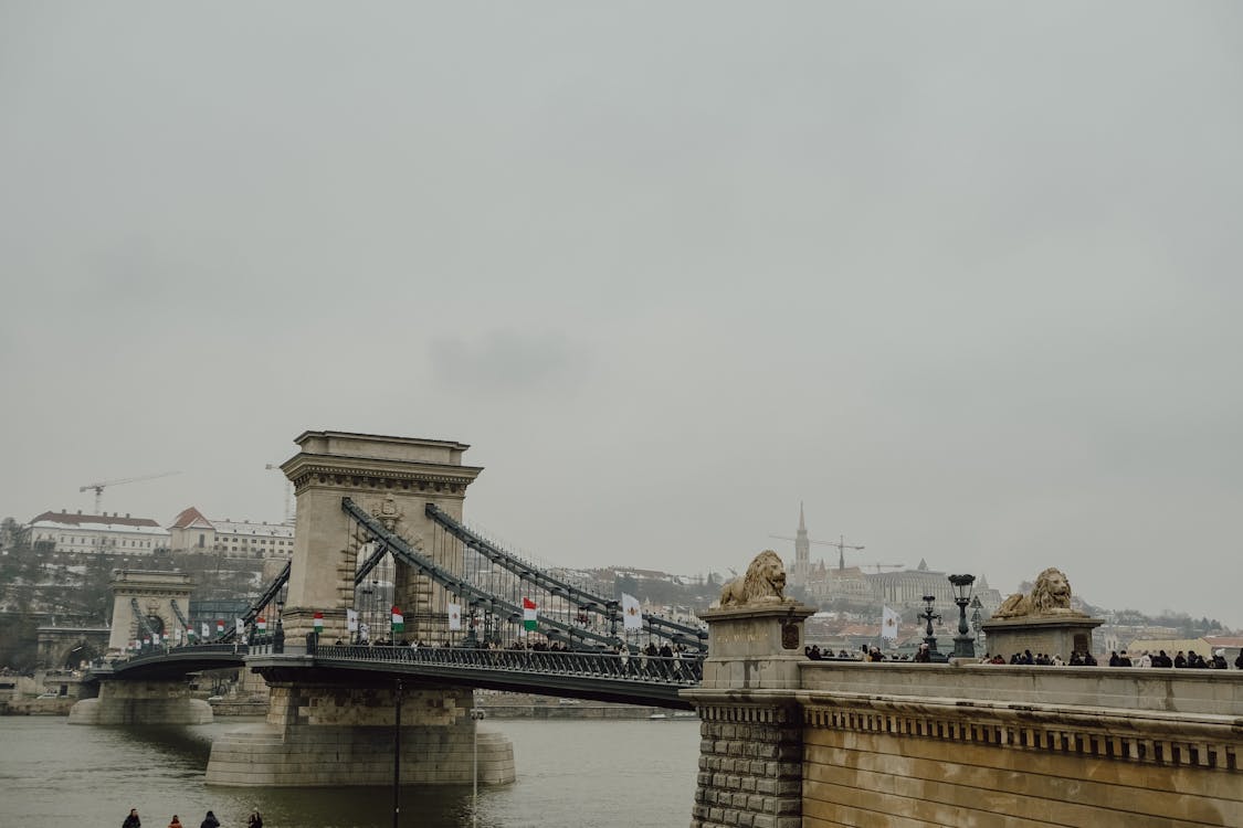 People walking on the bridge over the river