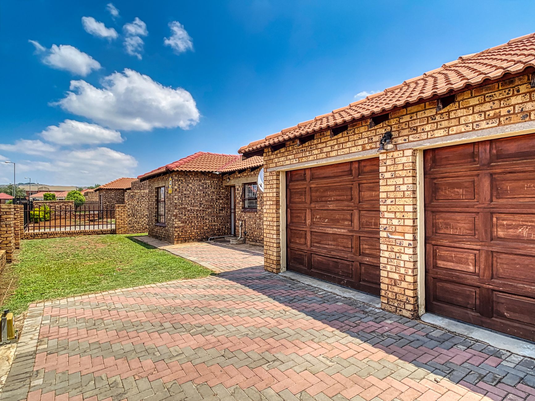 Beautiful brick home with double garage and paved driveway