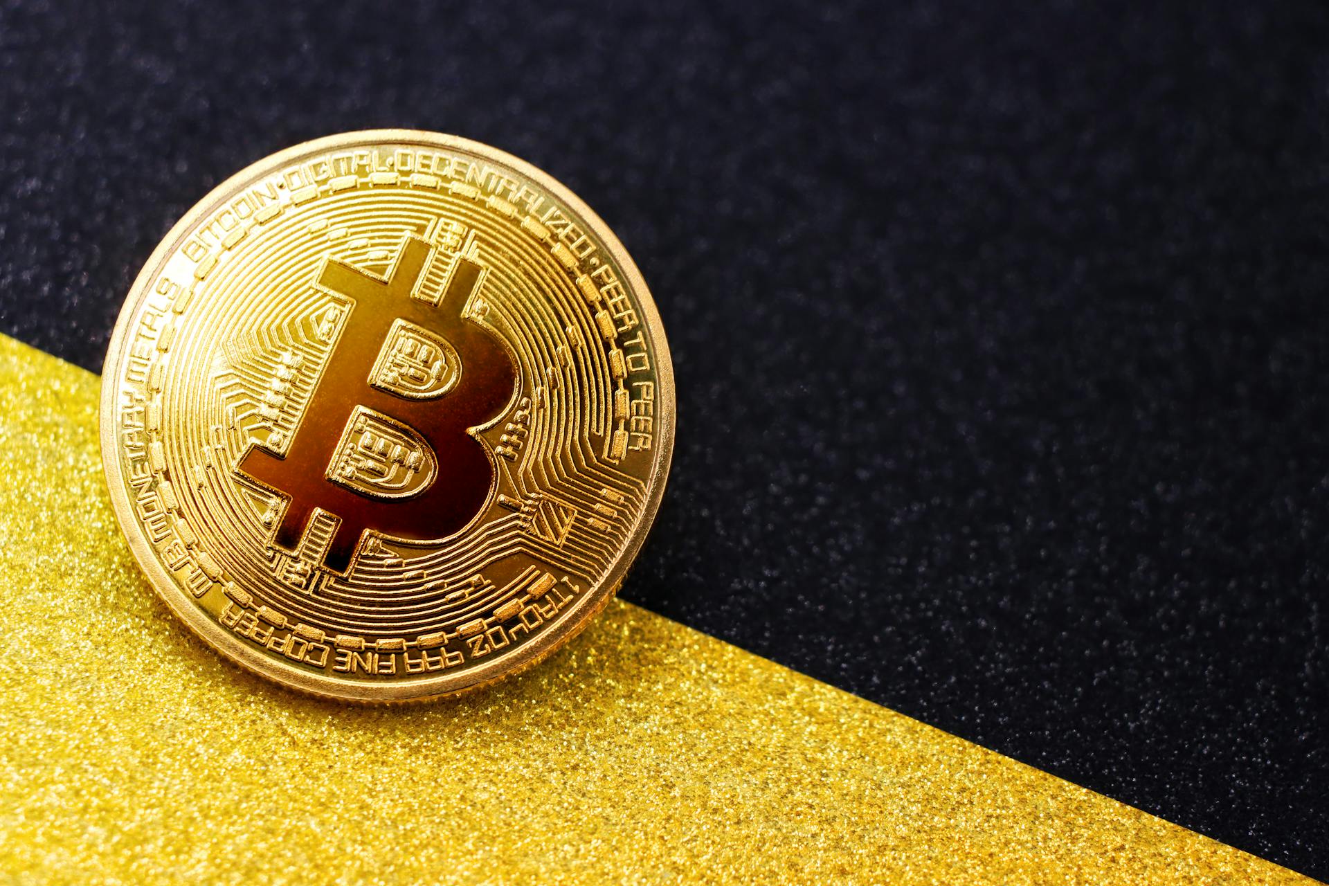 Golden Bit Coin on Black and Yellow