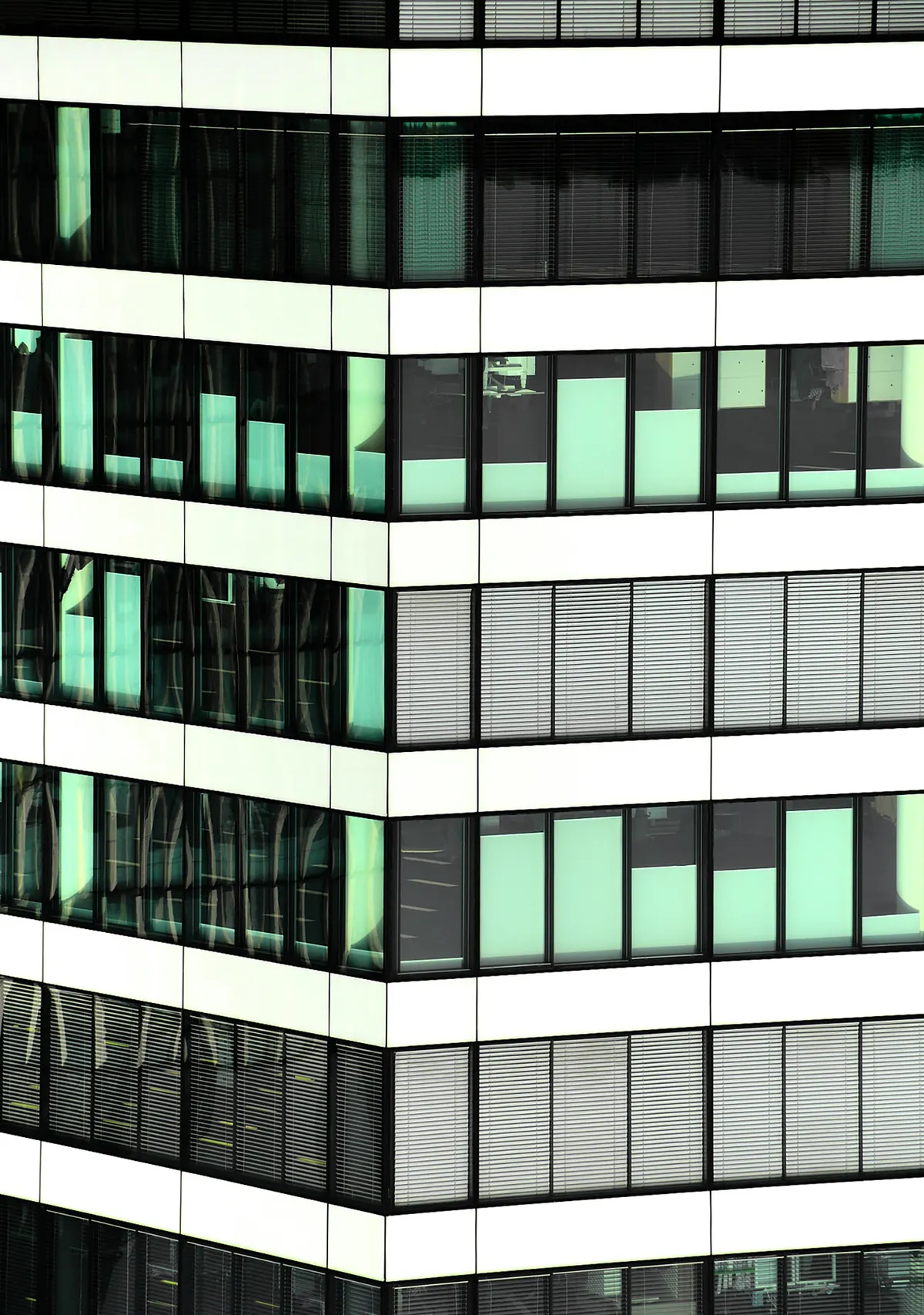 Close-up of a modern glass-and-steel office building facade