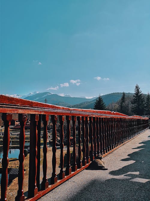 Brown Wooden Rail With Mountain Background