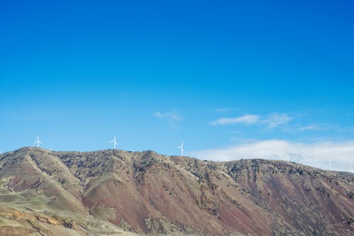 A mountain with wind turbines on it