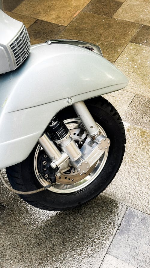 A close up of a motorcycle with its wheel on the ground
