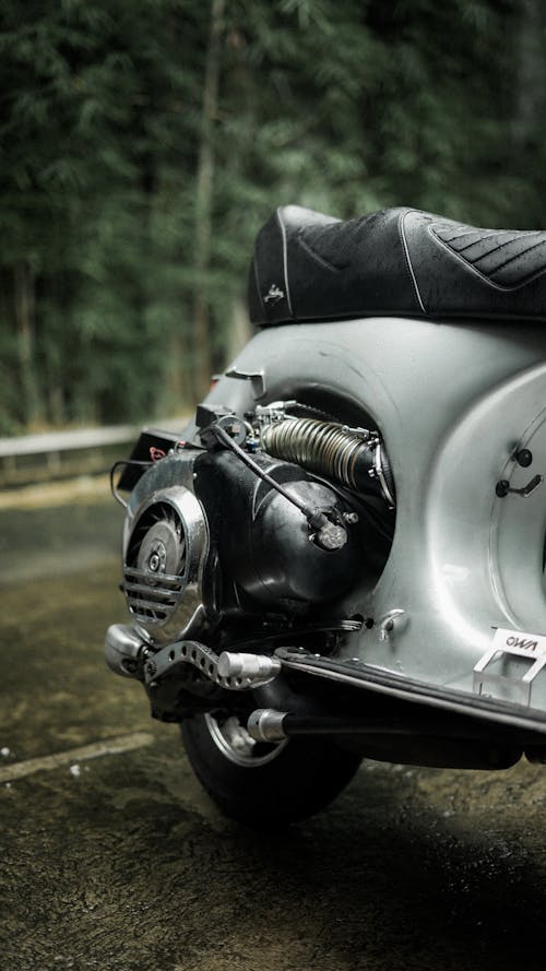 A close up of a motorcycle parked in the rain