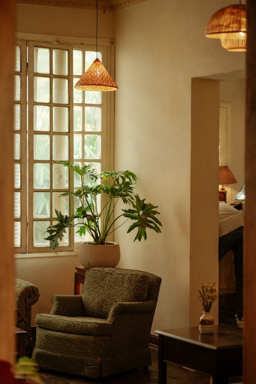 A living room with a large window and a chair