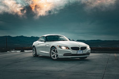A white bmw z4 parked on a cloudy day
