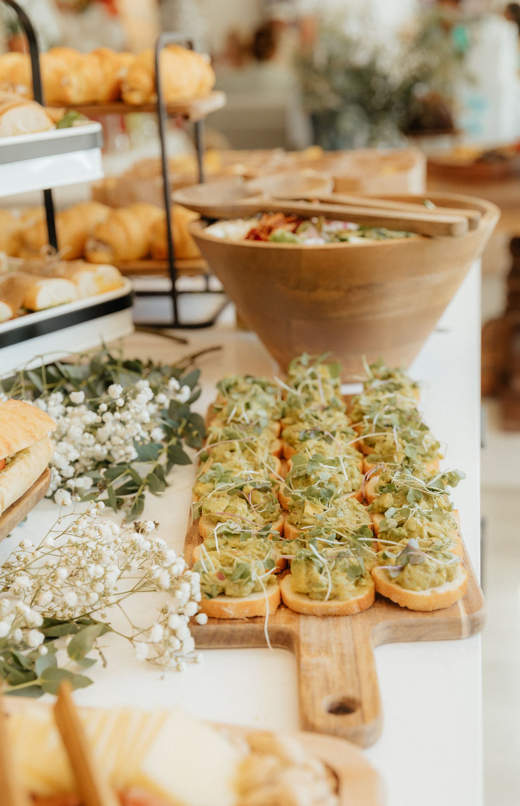 Elegant catered buffet with appetizers, salads and floral presentation