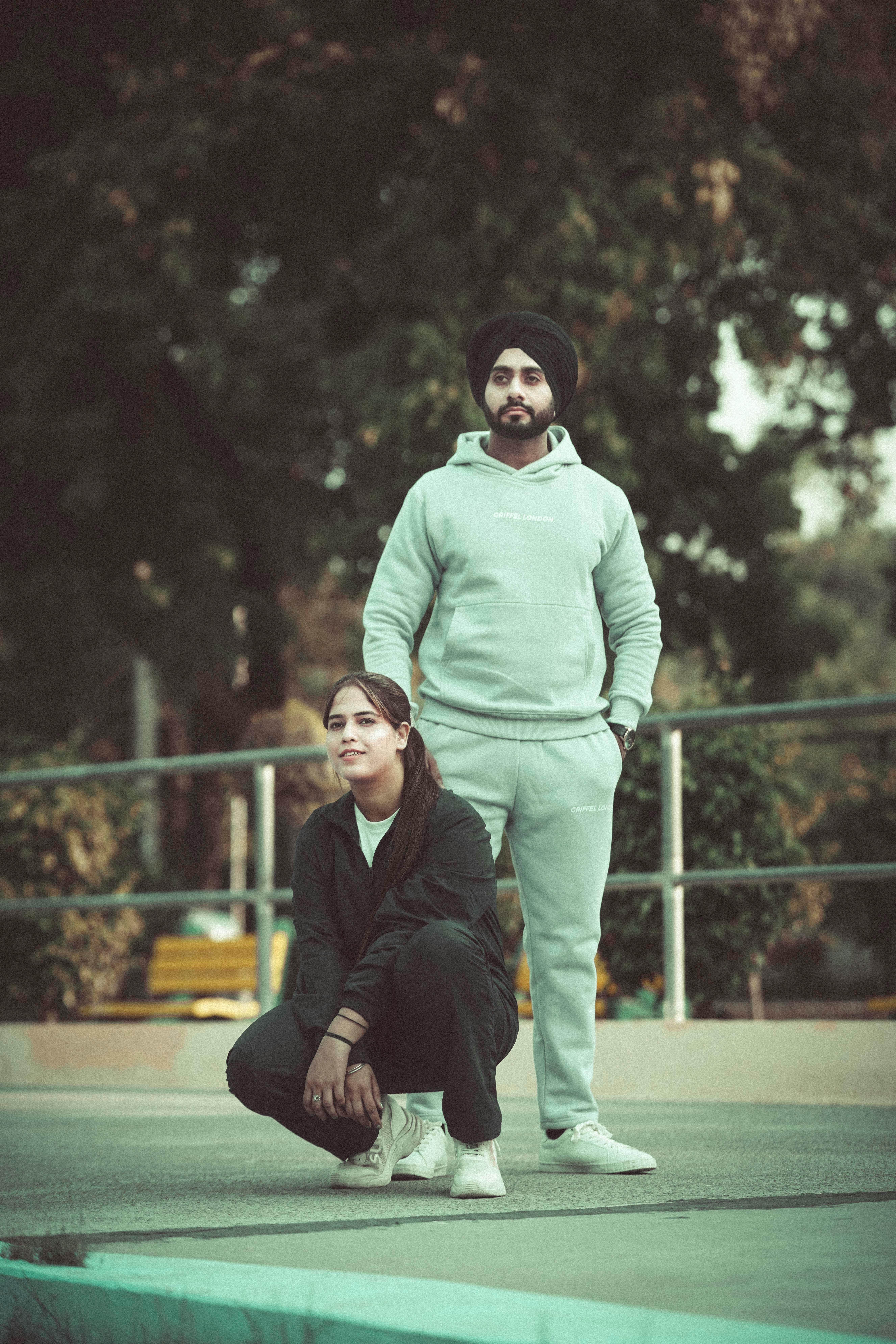 Two adults in a casual outdoor setting in Chandigarh, India.