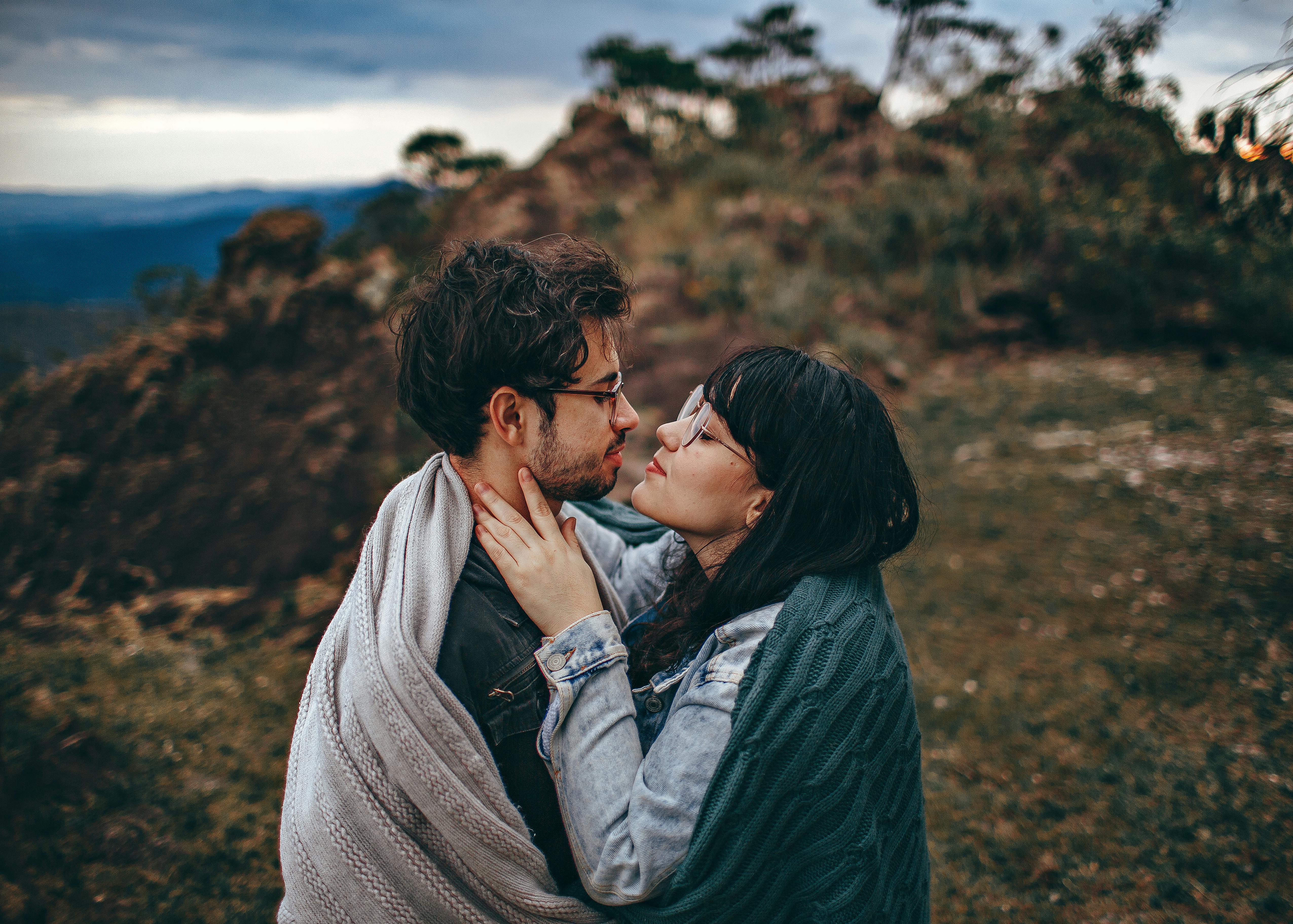 woman sharing blanket with man