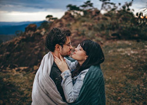 Woman Sharing Blanket With Man