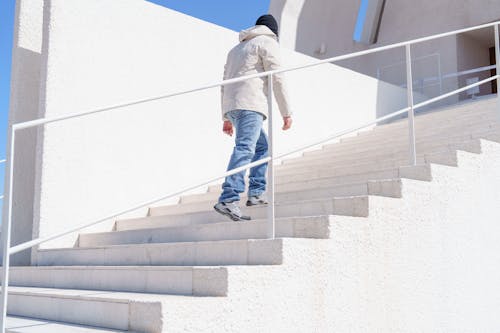 A man walking down a set of stairs