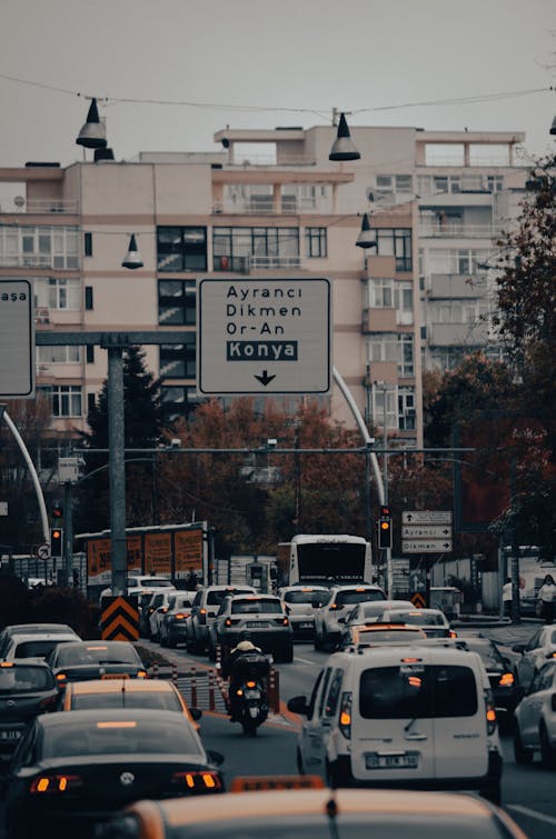 A city street with cars and buildings in the background