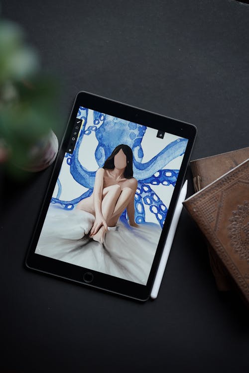A tablet with a photo of a woman on it