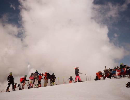 A group of people standing on a snowy hill