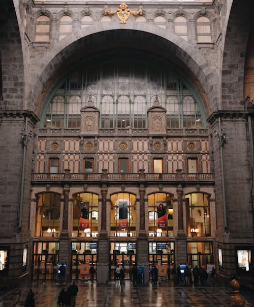 The inside of a train station with a clock