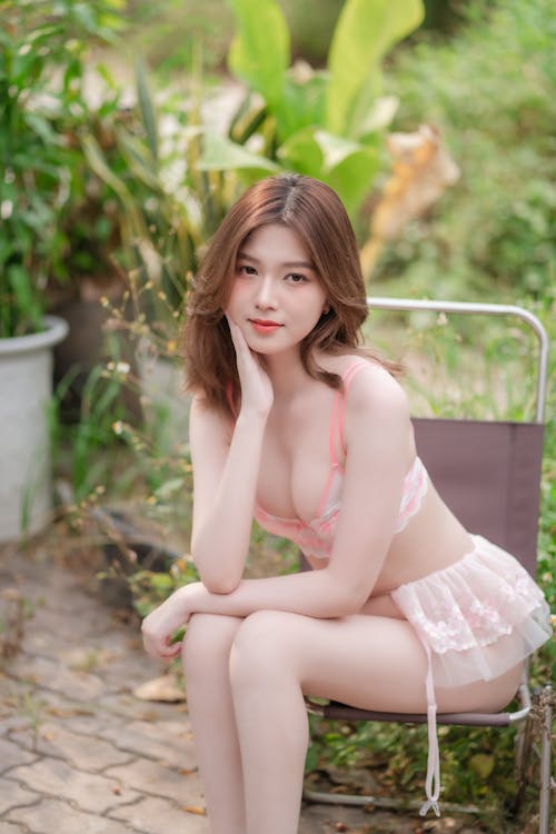 A beautiful asian woman in a pink underwear