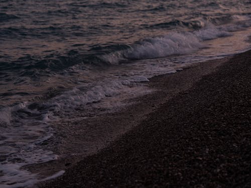 waves on the beach in the evening