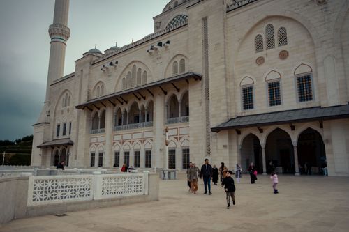 Free Grand Camlica Mosque's stunning facade with visitors in urban Istanbul, Turkey. Stock Photo