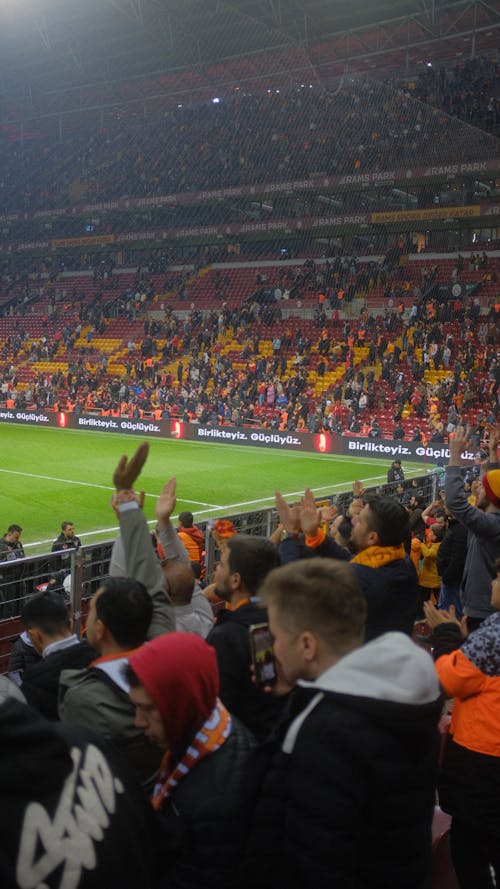 A soccer game with many people in the stands