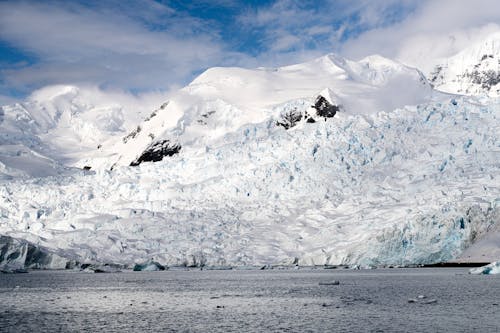 A large glacier with snow and ice on it