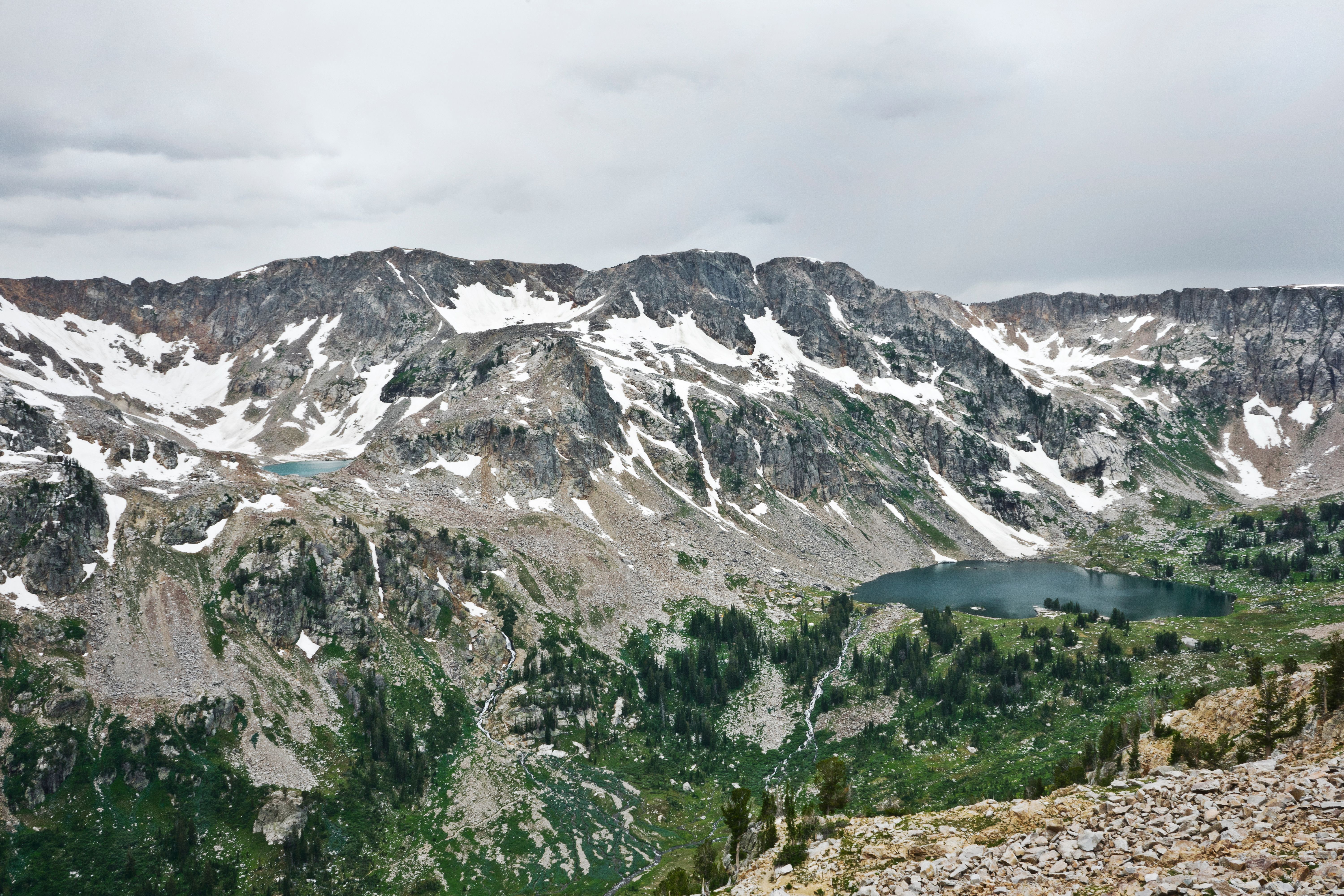 Majestic view of snow-capped mountains and alpine lake in Jackson, Wyoming.
