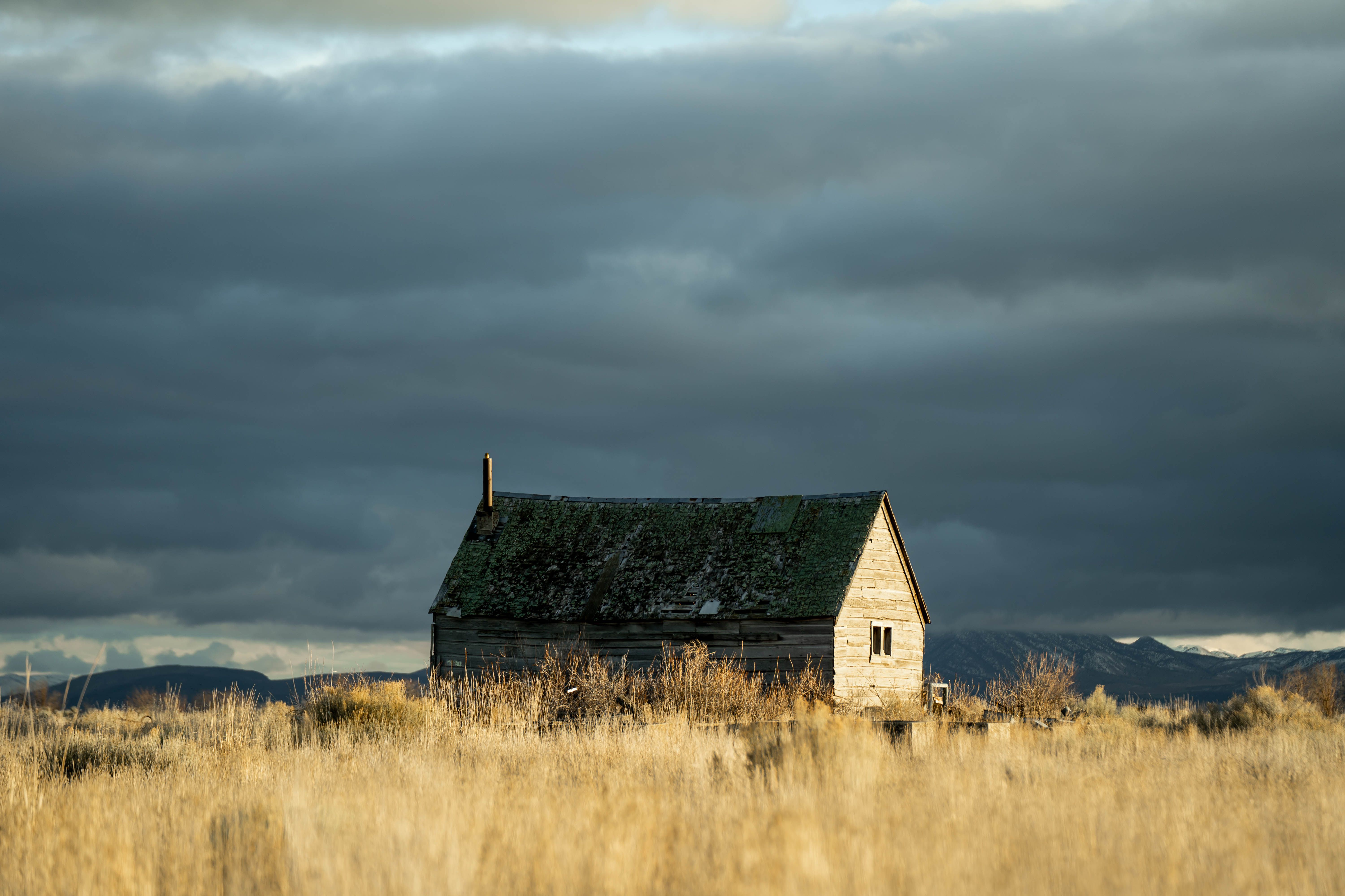 Grey and Brown House Near Green Grass Field · Free Stock Photo